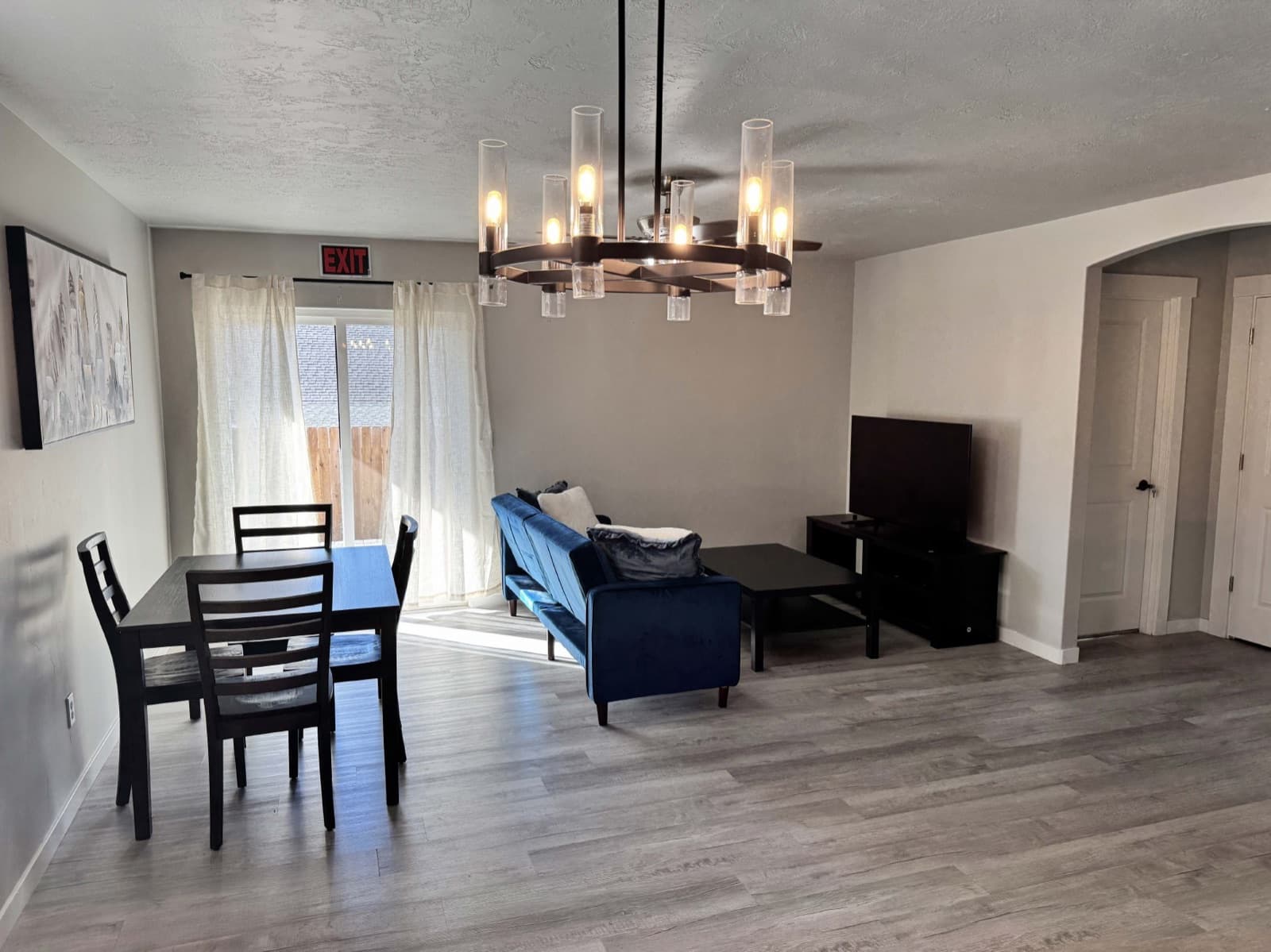 Open living and dining room with a sofa and a dining table